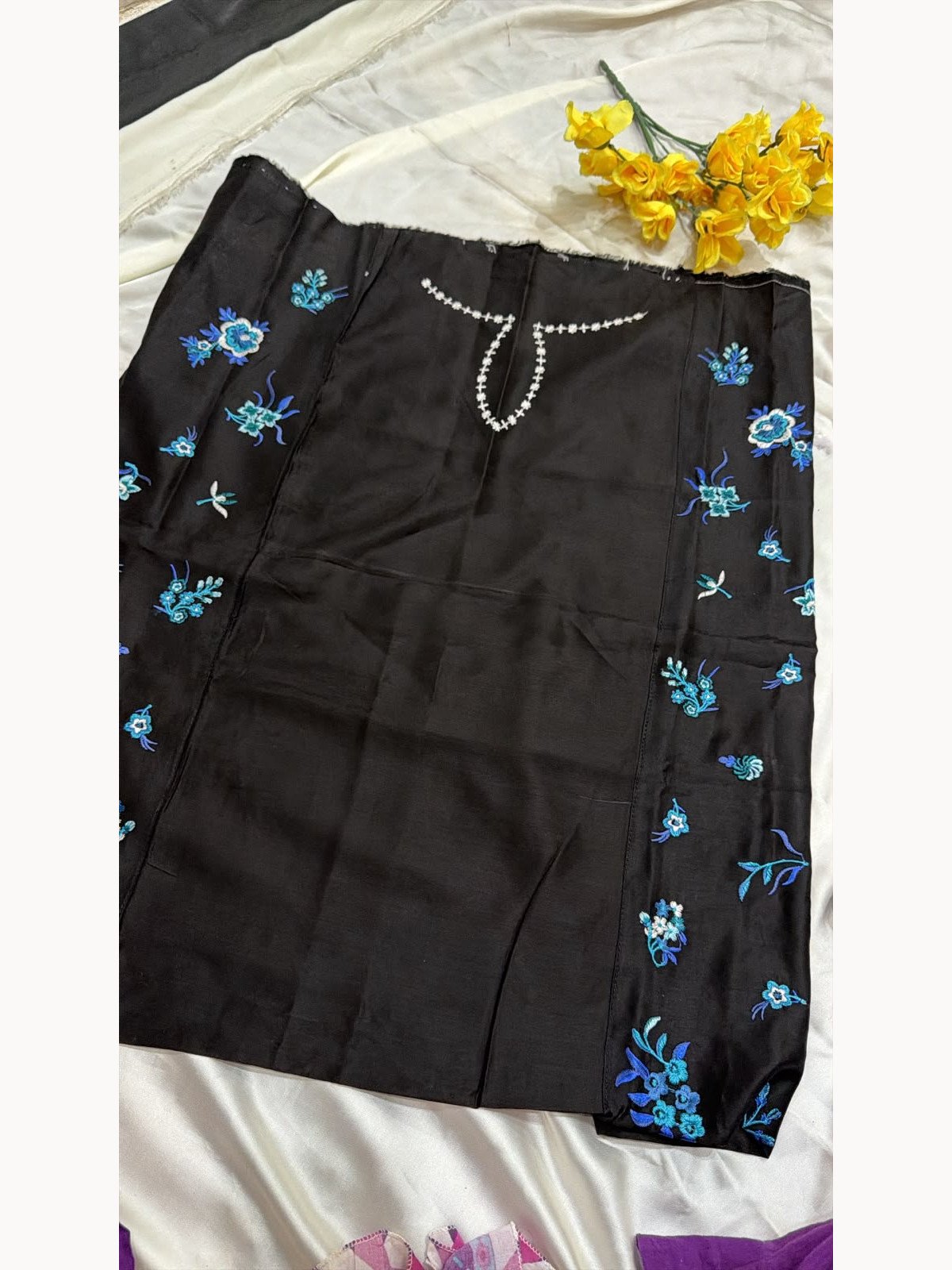 Black viscose shirt back with blue floral embroidery along both sides